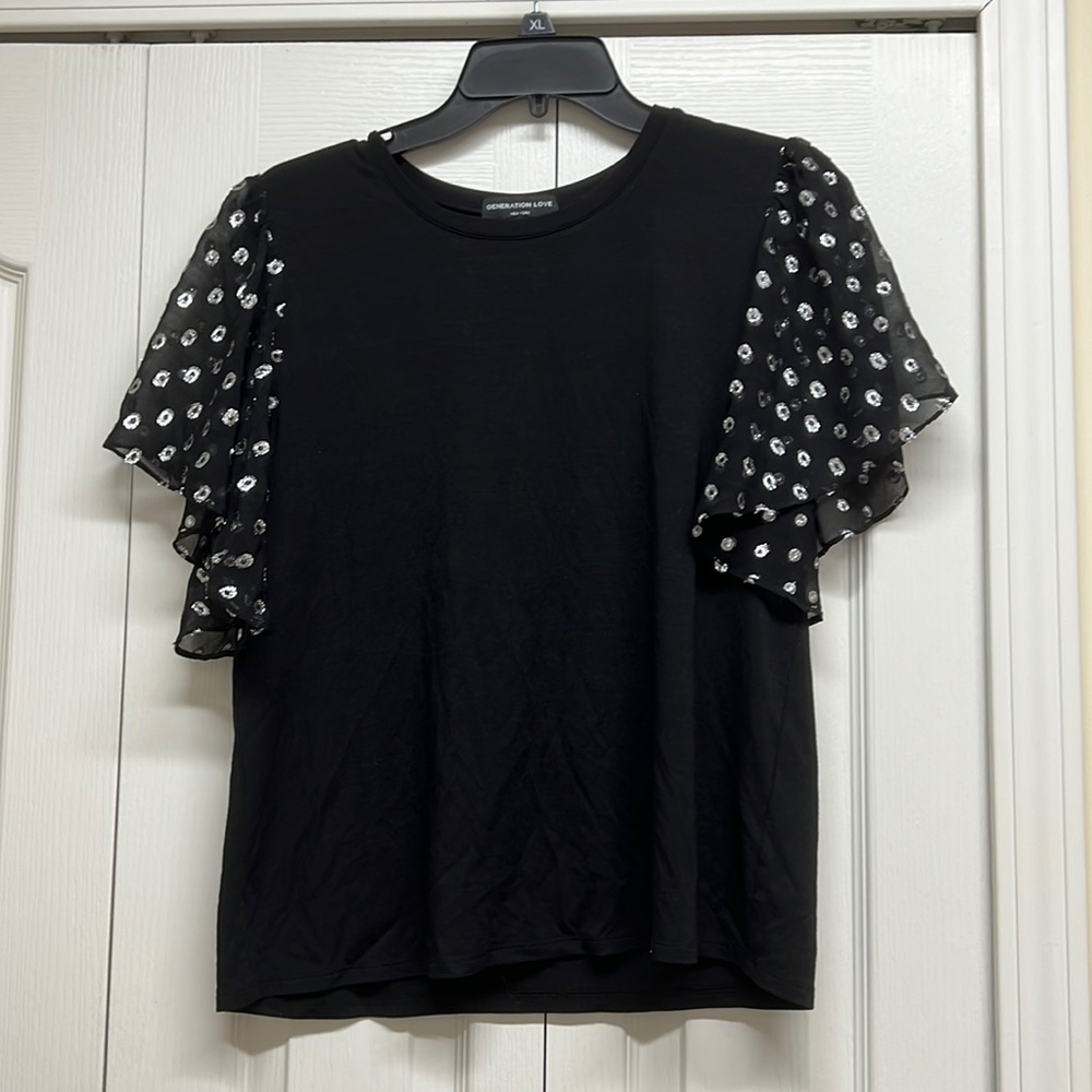 Generation love black top with sheer black and silver polka dots sleeves size M